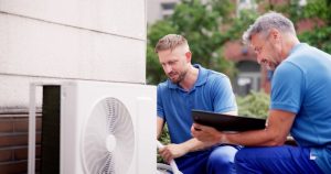 HVAC-techs-installing-a-unit