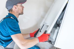 technician-opening-furnace-panel